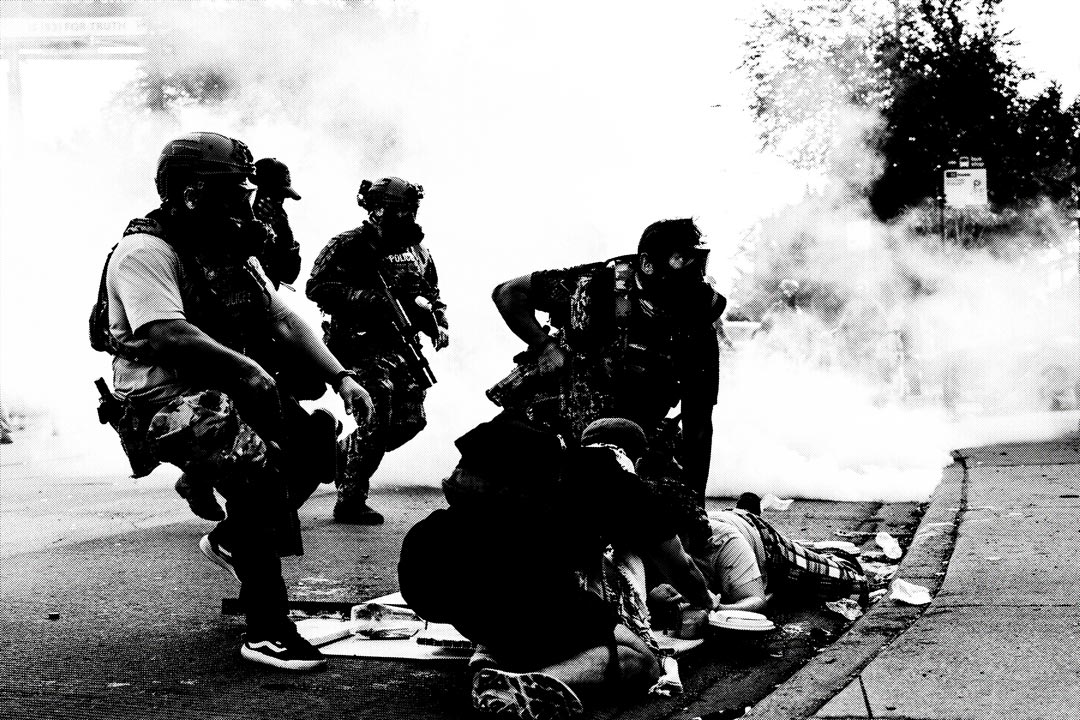 A monochrome image showing several ICE agents in tactical gear amidst smoke. One person is crouched on the ground while being brutalized by the agents.