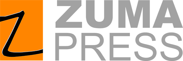 Protesters holding signs at March 4 Democracy rally advocating for voting rights and democracy.